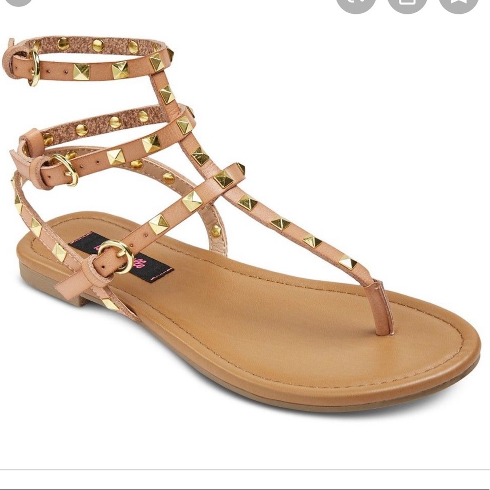 Tan gladiator sandals with gold hardware